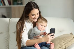 Mother and baby with phone