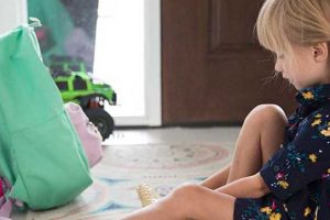 girl putting on shoes