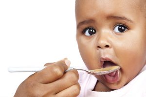 Baby eating solid food