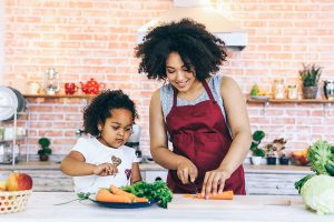 Mother and daughter cooking